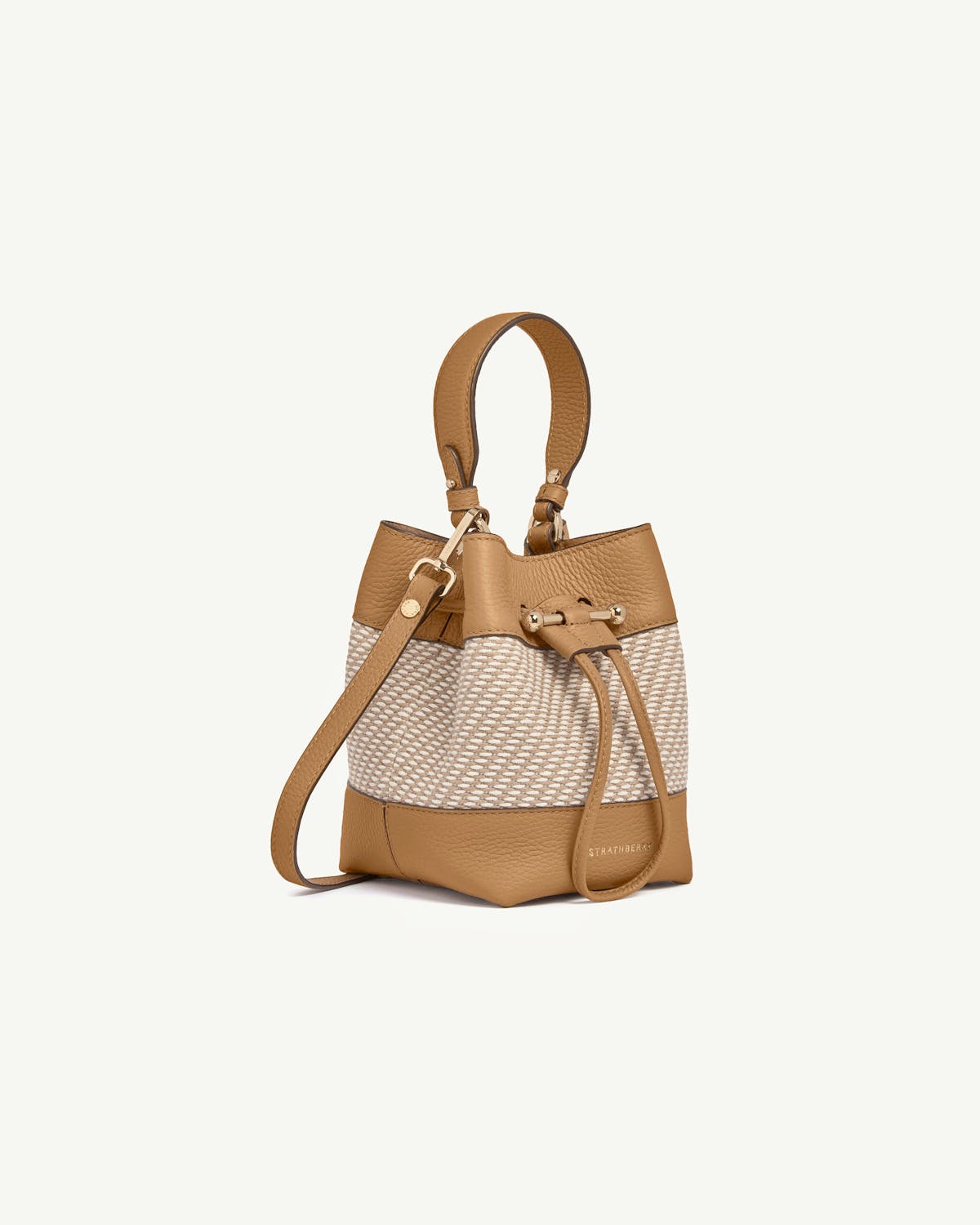 Caramel leather and natural twill Osette bucket bag with top handle and shoulder strap, Strathberry.