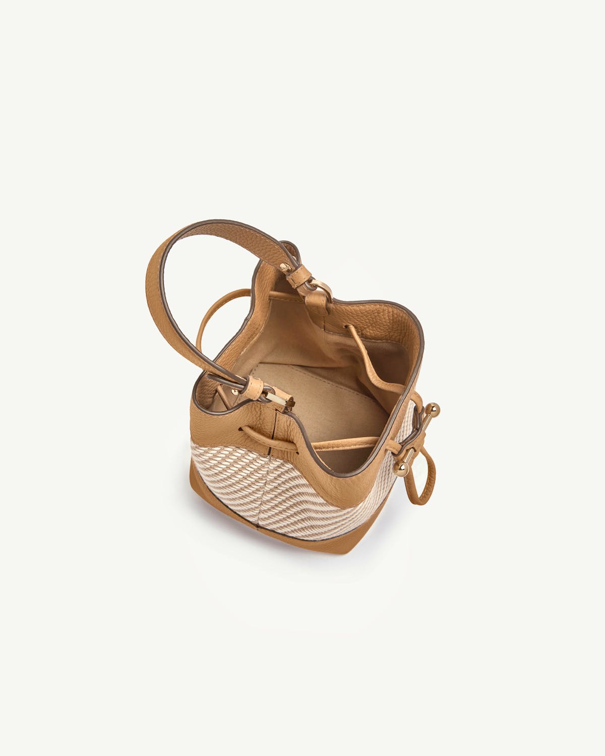 Osette caramel leather and natural twill bucket bag with drawstring, open interior.