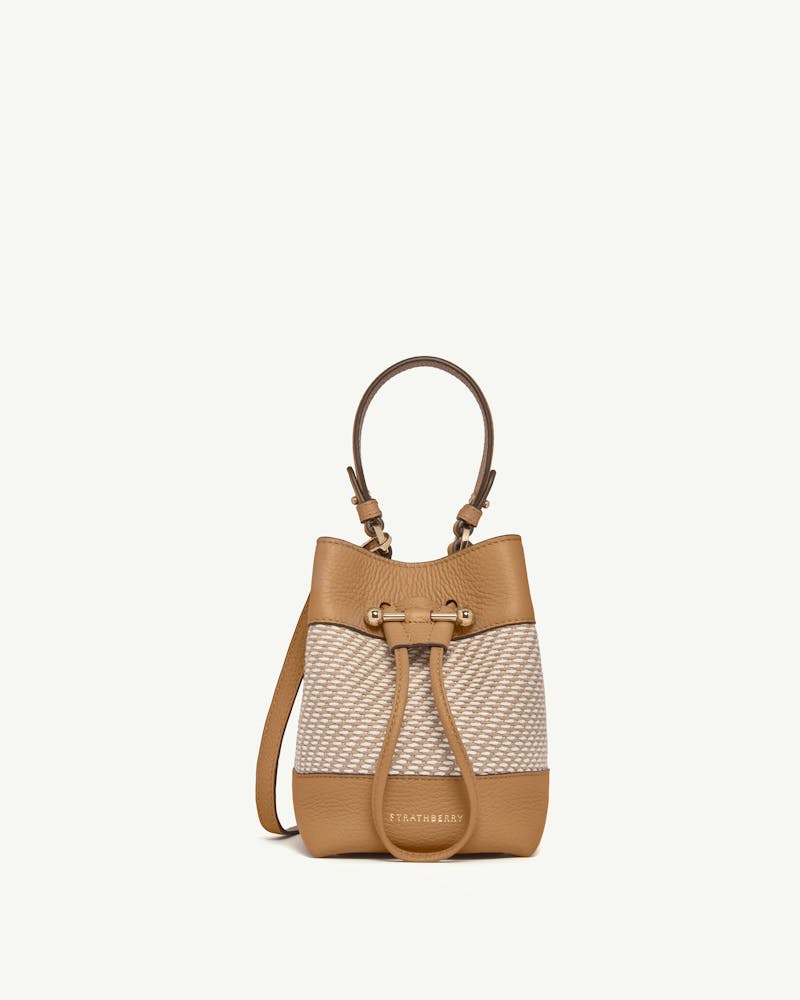 Strathberry Osette bucket bag in caramel leather and natural twill.