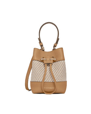Caramel leather bucket bag with natural twill panel, drawstring closure and shoulder strap