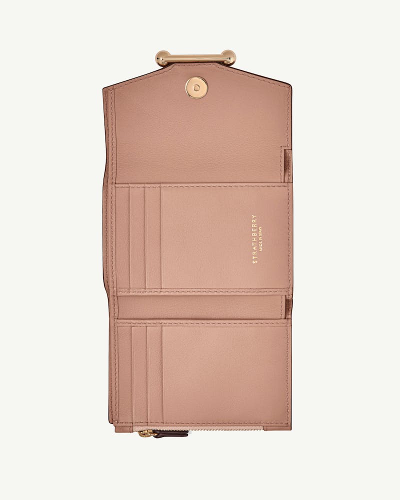 Rose mosaic trifold wallet open showing card slots, zip coin pocket and Strathberry logo.