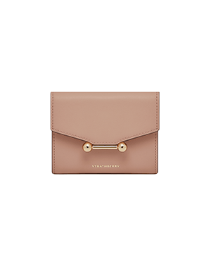Strathberry Mosaic trifold wallet in rose with gold bar fastening.