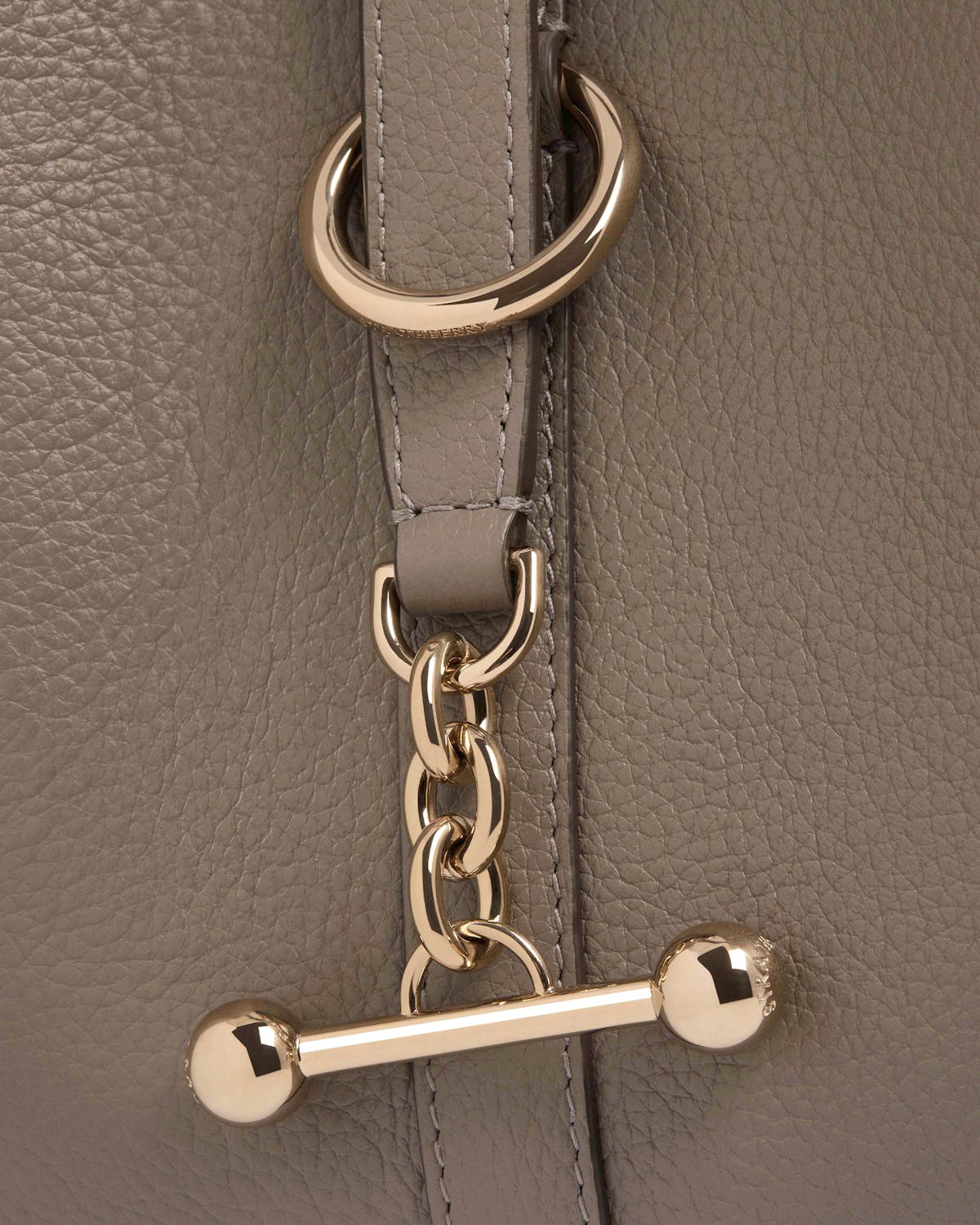 Taupe grained leather with gold chain hardware and Strathberry engraved ring