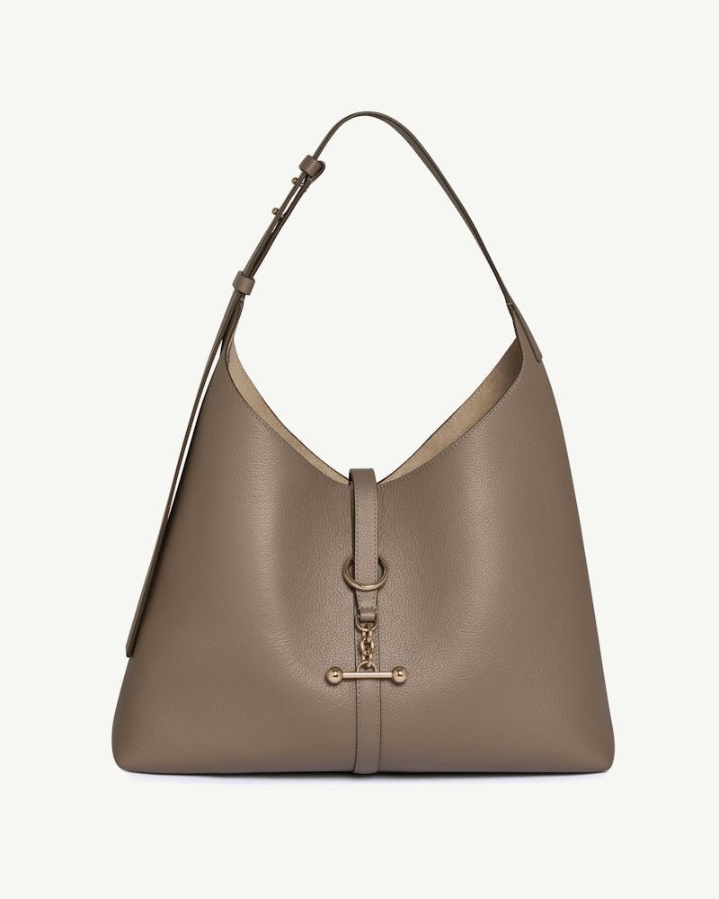 Taupe pebbled leather hobo bag with adjustable shoulder strap and gold ring toggle.