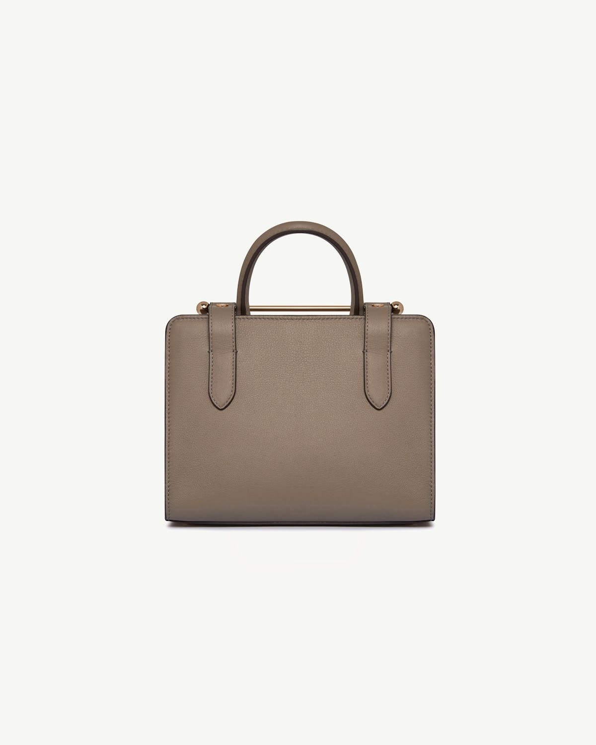 Taupe mini tote with top handles, pebbled leather and gold bar detail.