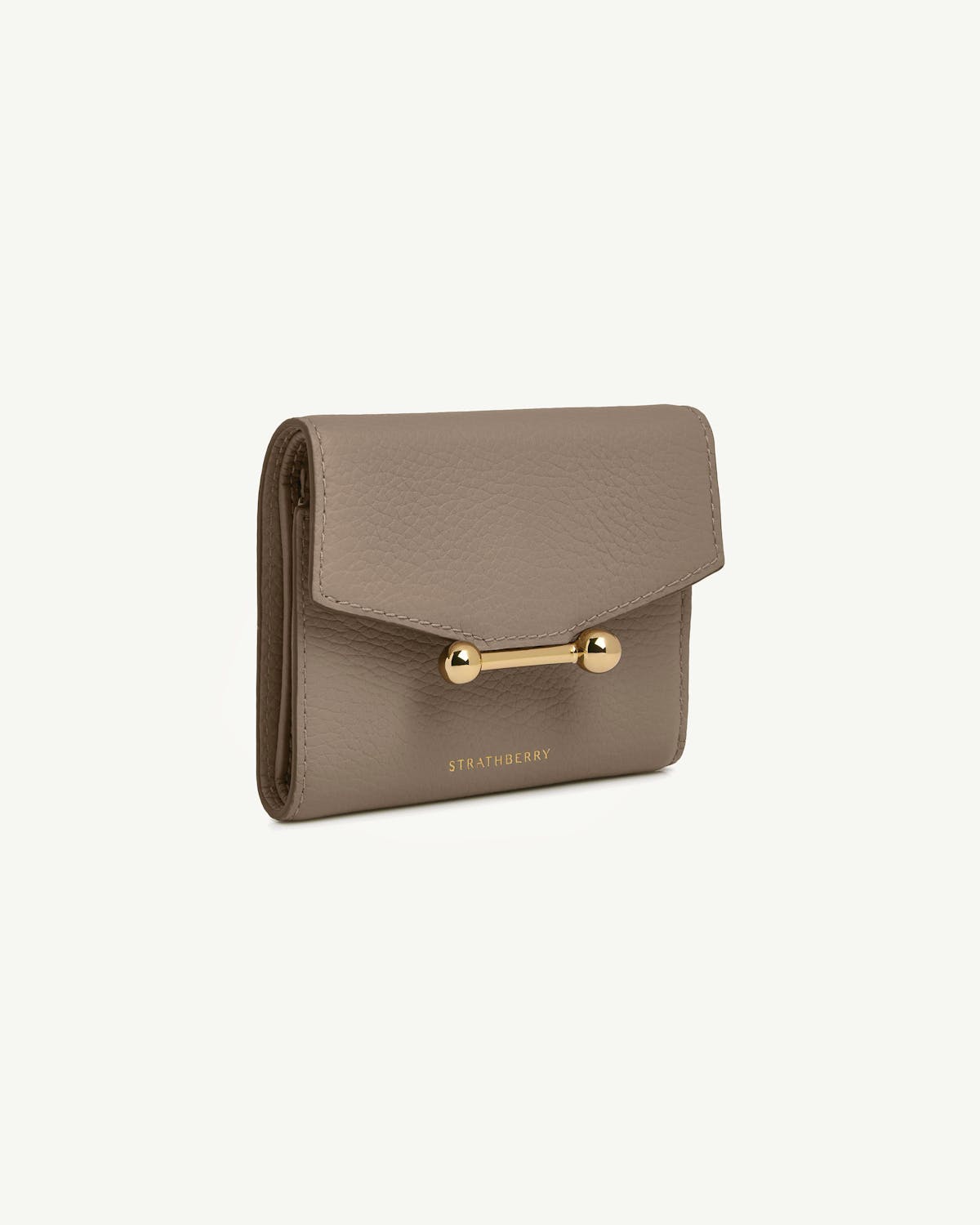 Strathberry mosaic trifold wallet in taupe pebble leather with gold bar closure.