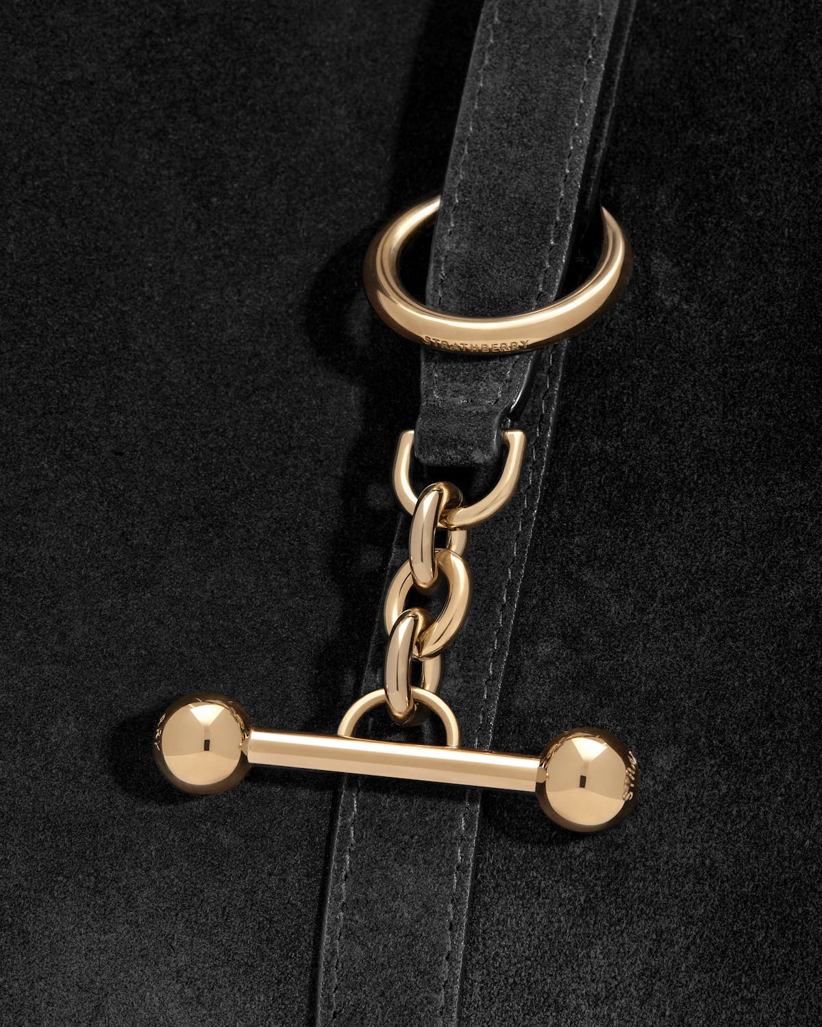 Strathberry Kite Hobo black suede strap with gold ring, chain and toggle clasp.