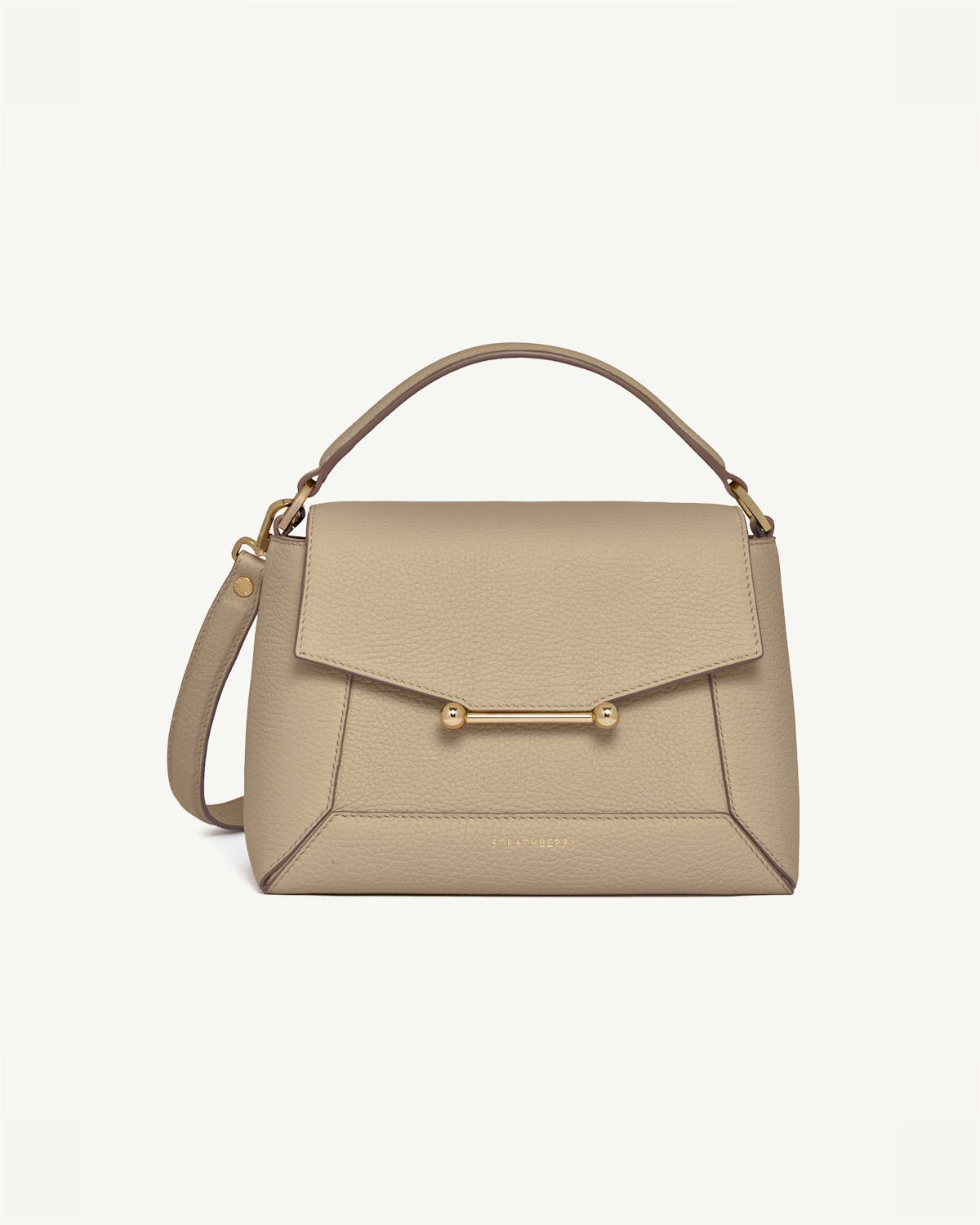 Sand mosaic leather top-handle bag with gold bar closure and shoulder strap.