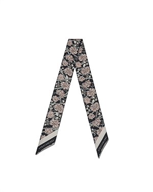 Black and oat floral silk skinny scarf with tapered ends and patterned border.