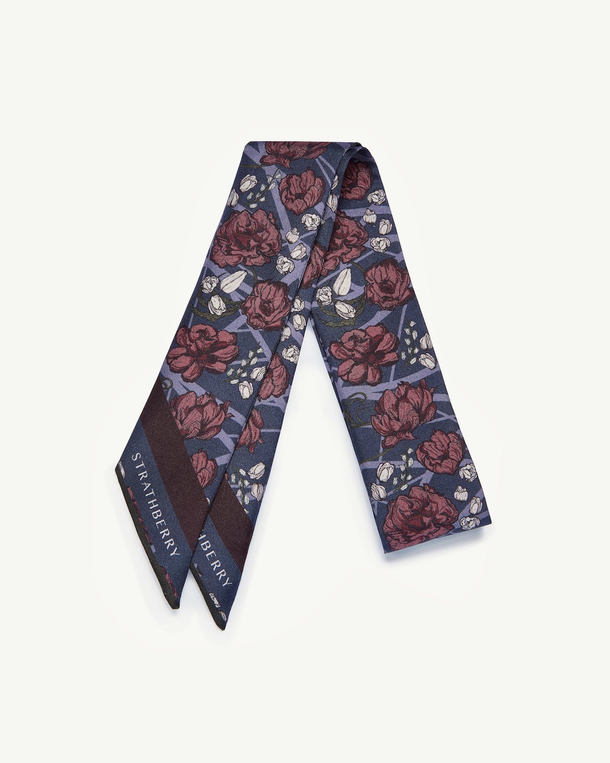Navy silk skinny scarf with burgundy floral print and Strathberry logo.