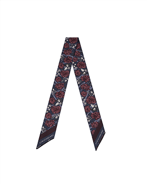 Burgundy and navy floral silk skinny scarf arranged in a V shape.