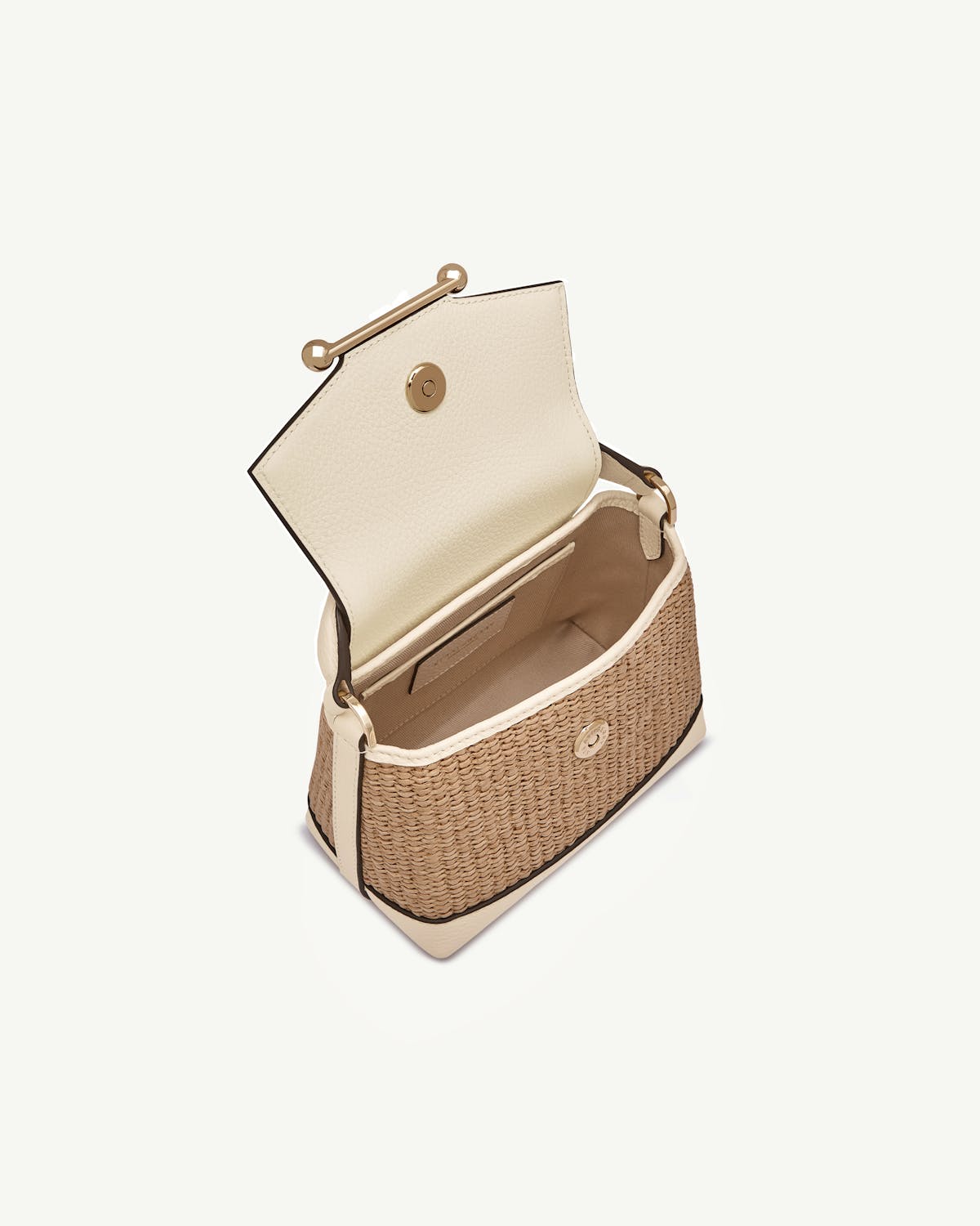 Small vanilla raffia woven bag with cream leather flap and open interior