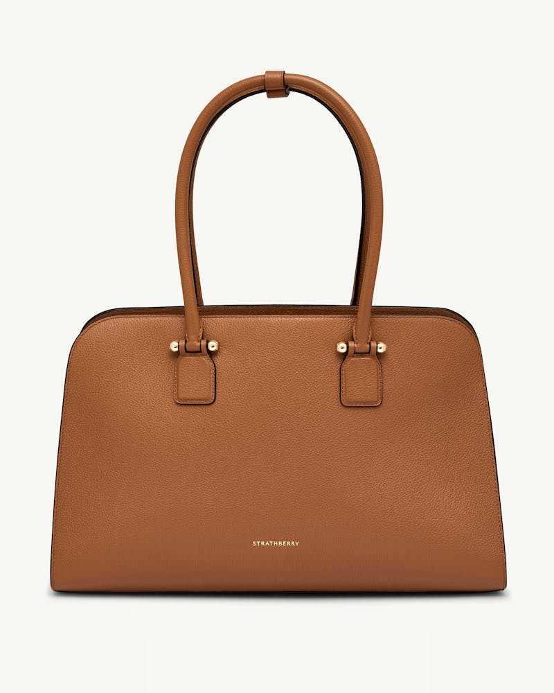 Tan Georgia Maxi leather tote with double top handles and gold Strathberry logo.