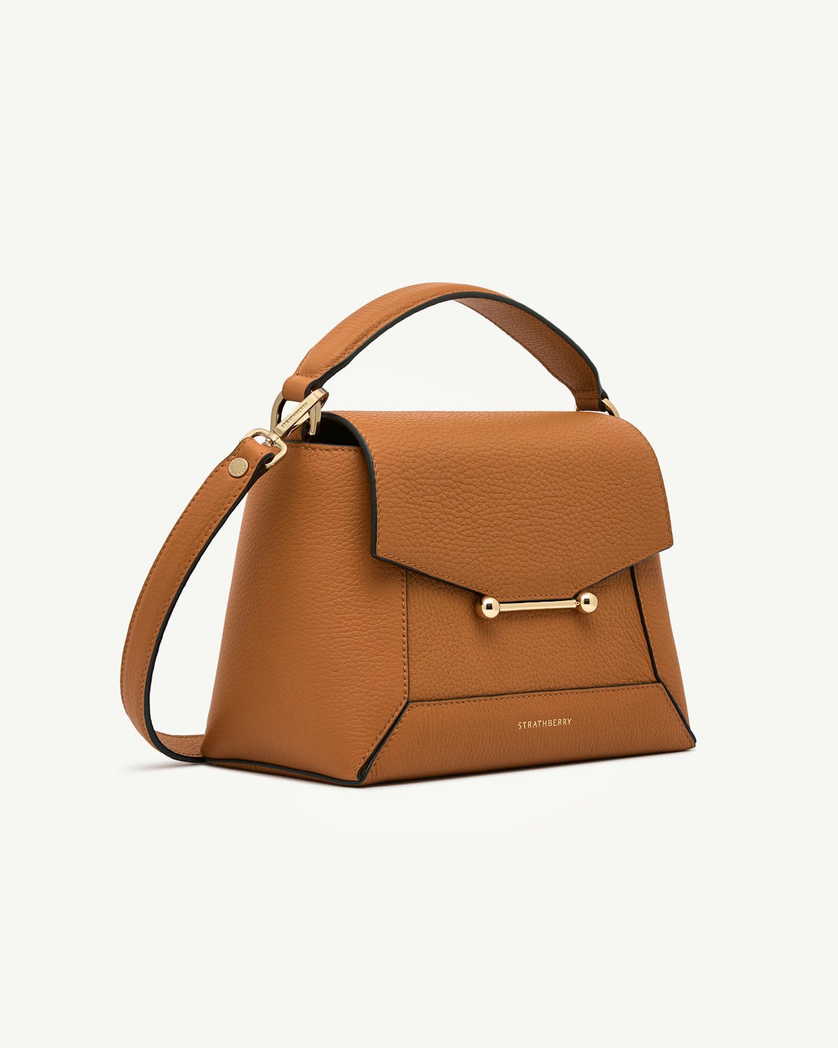 Honey pebbled leather mosaic bag with top handle, gold bar and Strathberry logo.