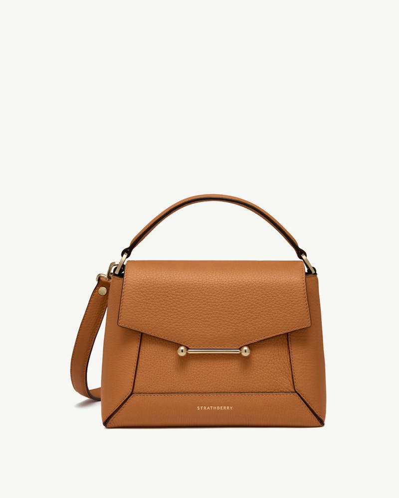 Honey leather mosaic bag with top handle, gold bar detail and Strathberry logo.