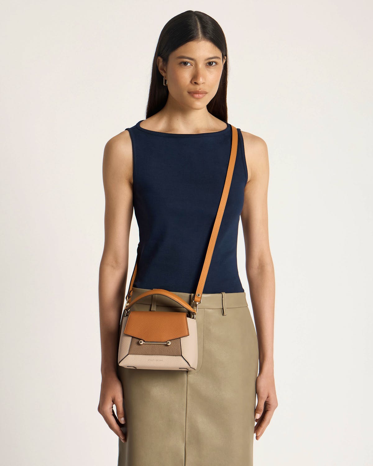 Model wearing Strathberry Mosaic Nano crossbody bag in oat, honey and clay.