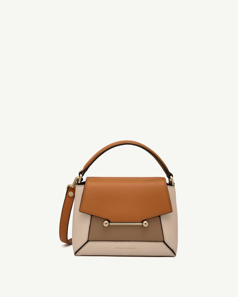 Tricolour oat, honey and clay leather top-handle bag with gold bar closure, Strathberry logo.