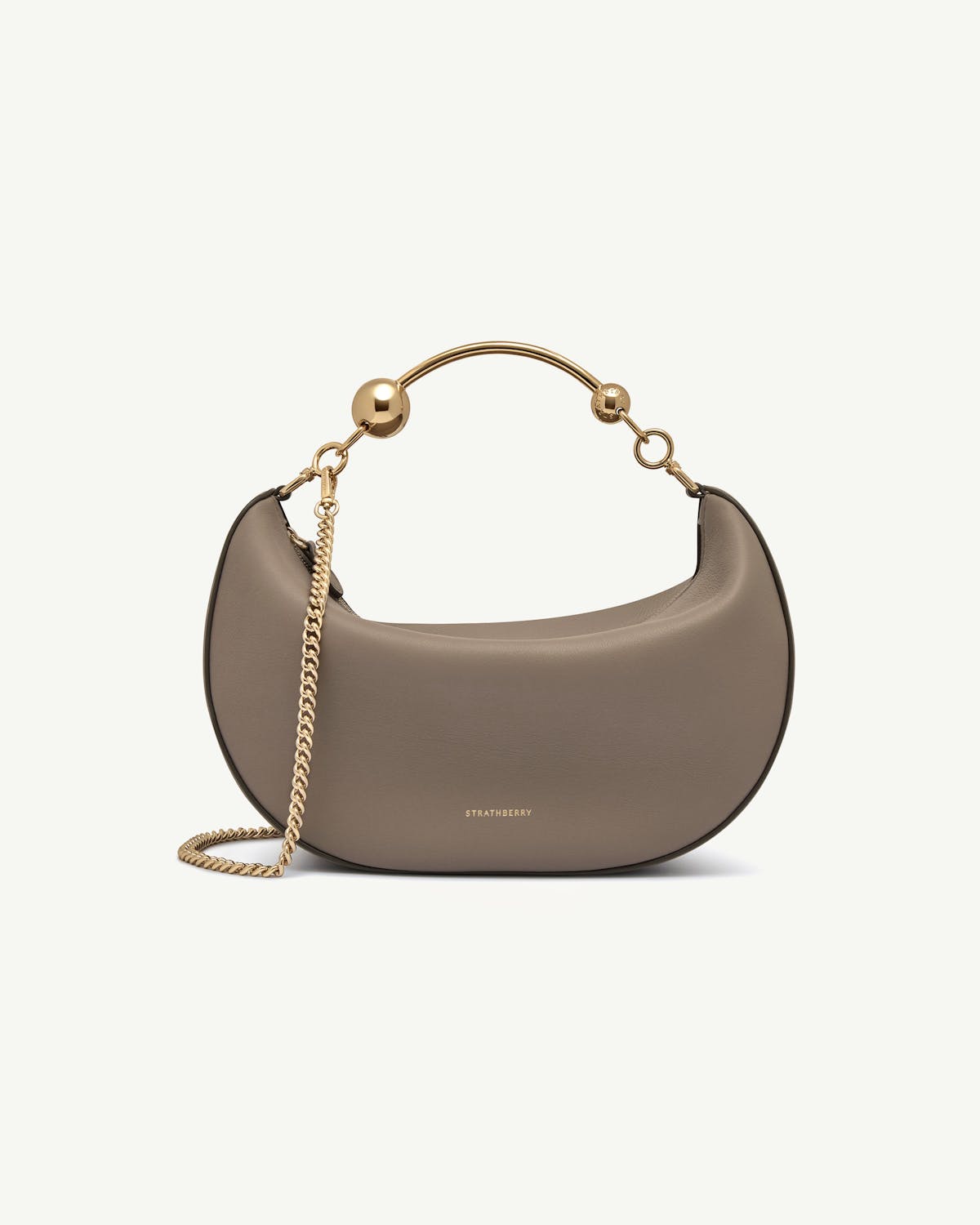 Taupe Crescent Moon shoulder bag with gold chain strap, Strathberry logo.