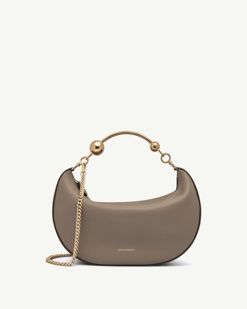 Taupe crescent moon bag with gold chain and Strathberry logo