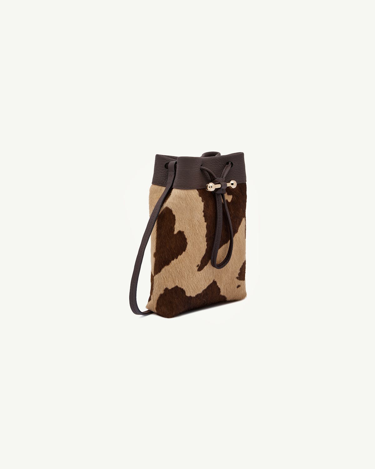 Midi pouch in sand and espresso spot print with drawstring and leather trim