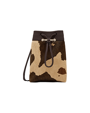 Sand and espresso spot-print midi pouch with drawstring closure and shoulder strap.