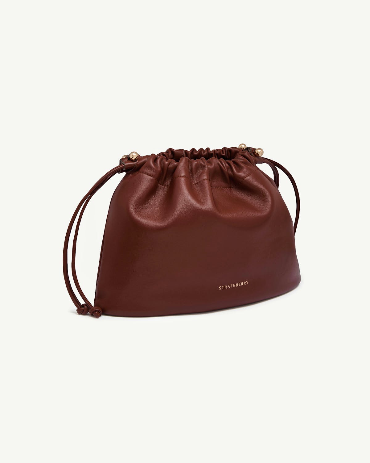 Walnut leather Strathberry Charlotte Midi drawstring bag with gold hardware.