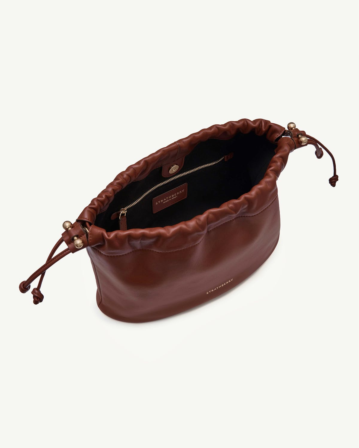 Strathberry Charlotte midi drawstring bag in walnut leather, top view showing interior