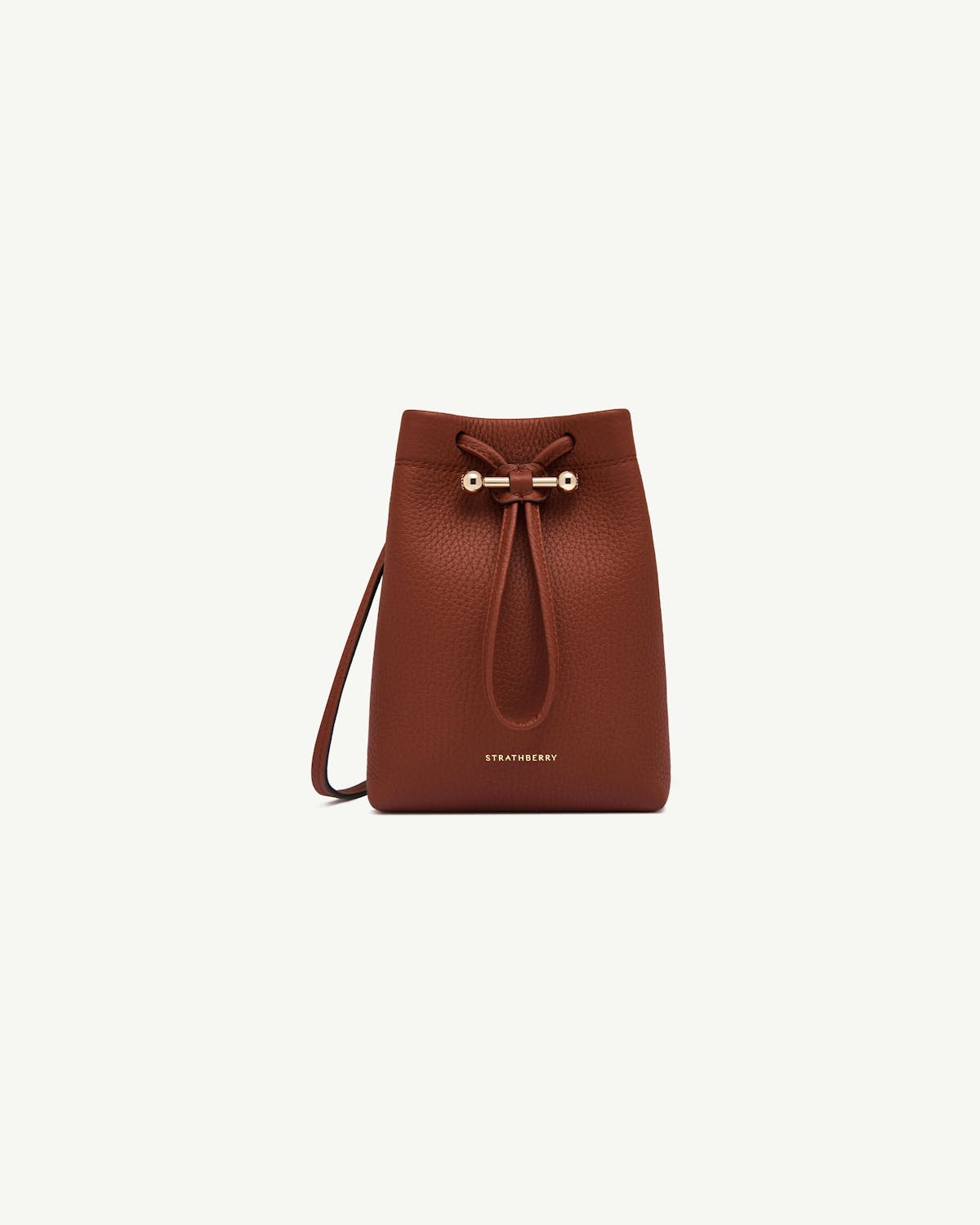 Strathberry Osette midi pouch in walnut leather with drawstring and gold bar.