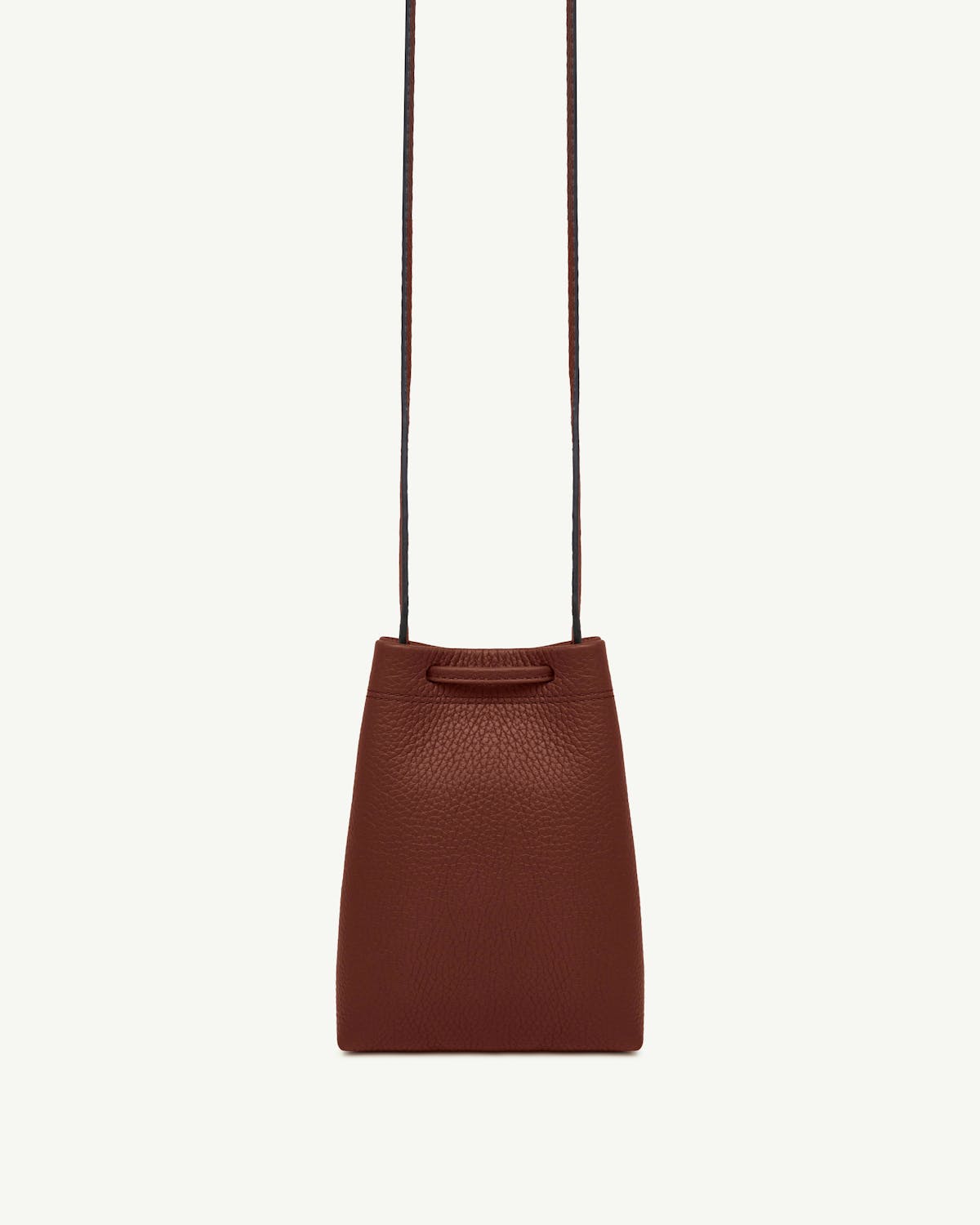 Walnut leather midi pouch with long thin strap and pebbled texture.