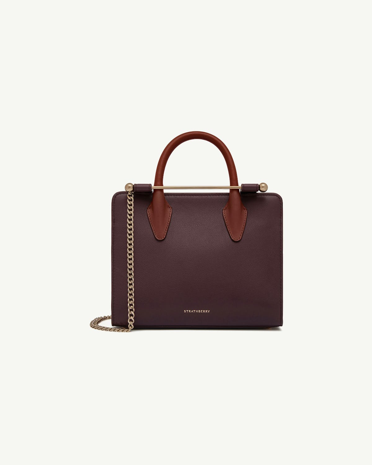 Strathberry mini tote in burgundy with chestnut handles and gold chain strap