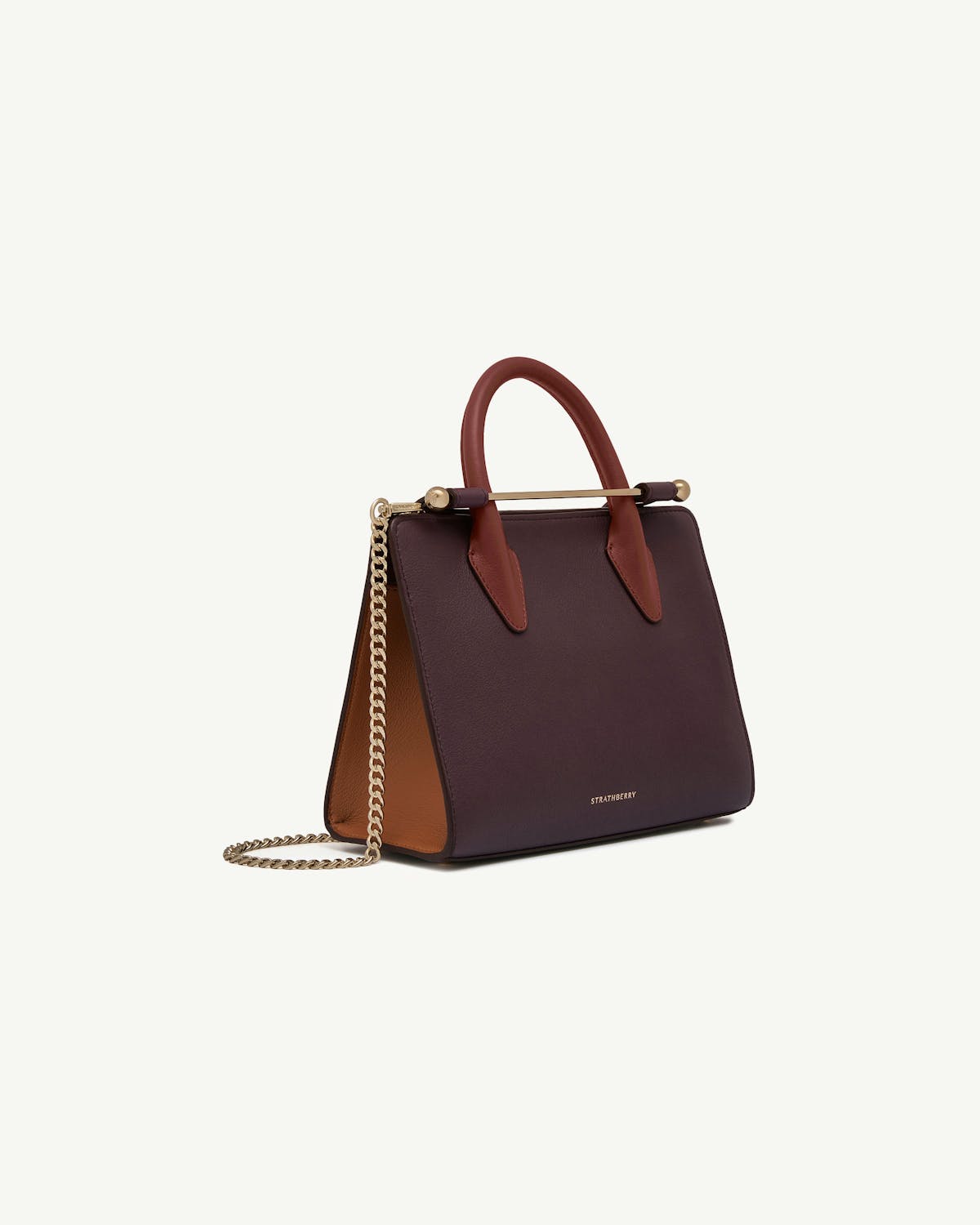 Strathberry burgundy mini tote with chestnut handles, gold bar and chain