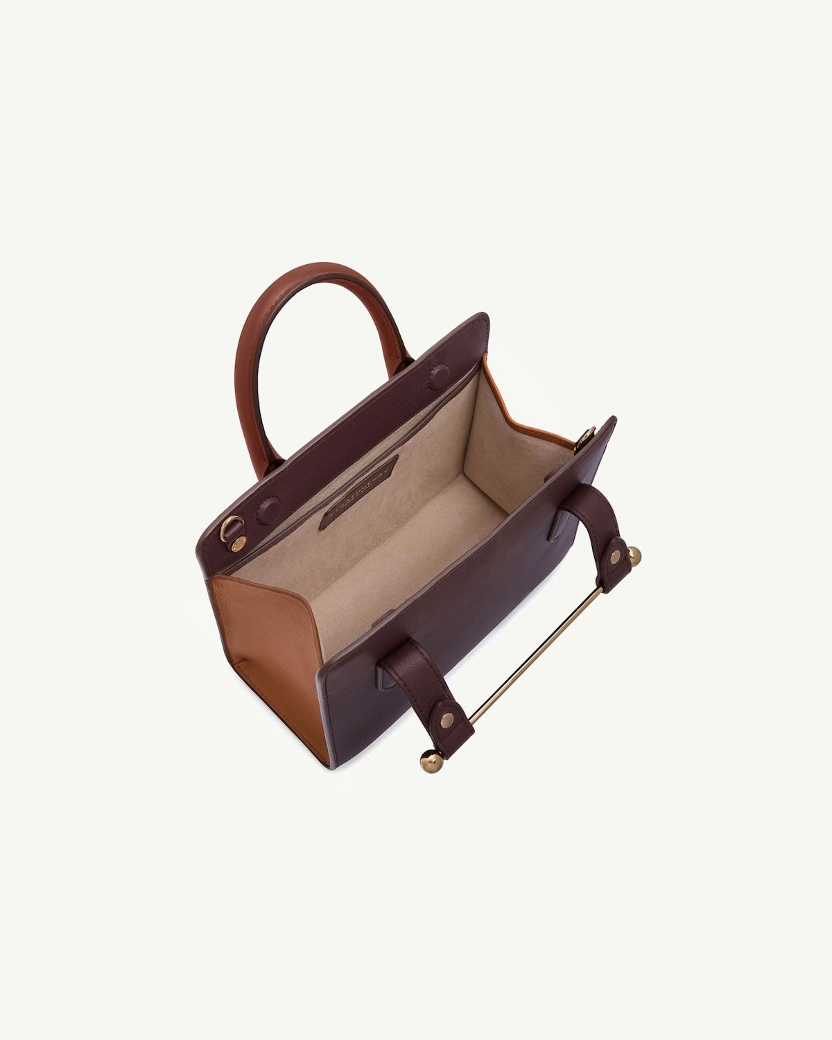 Open mini tote in burgundy, chestnut and walnut leather, top view.